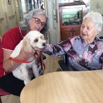 Pet pooch visits Illoura residents with its owner, an NHW volunteer