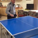 Elderly gentleman playing ping pong