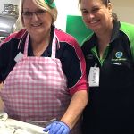 Illoura staff wearing small green top hats while baking to celebrate St Patrick's Day at Illoura